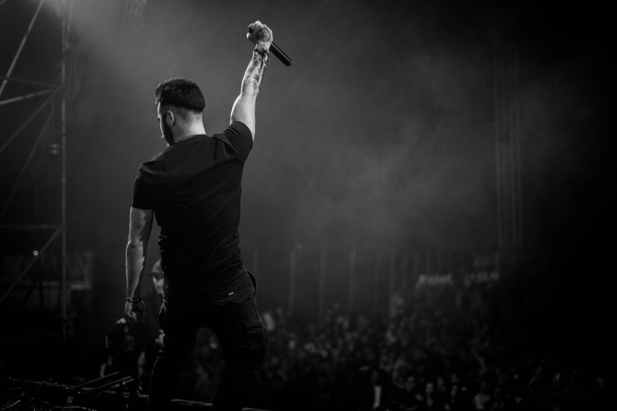 K-pop star with microphone, on stage