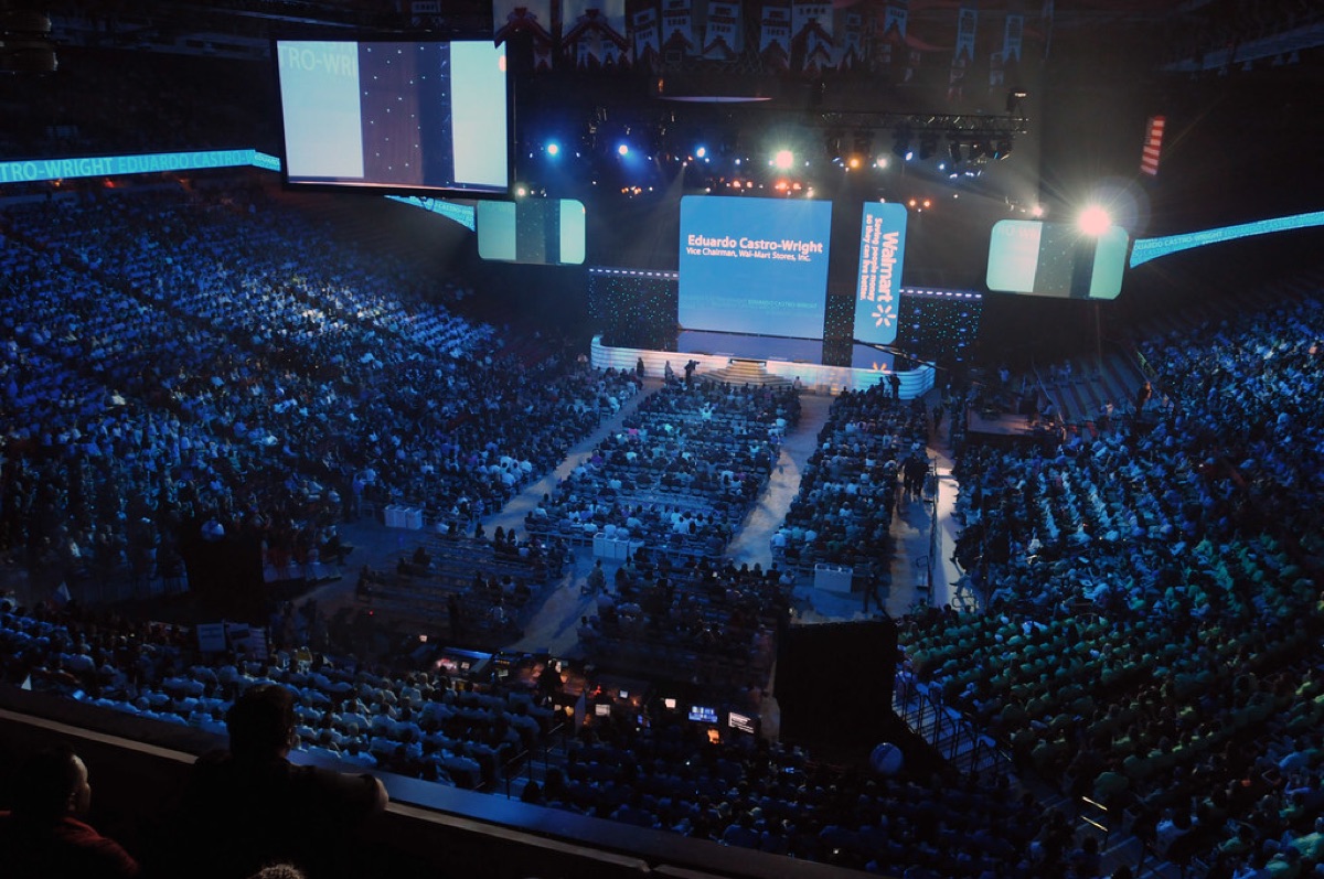 A massive crowd of fans at a large scale music arena concert