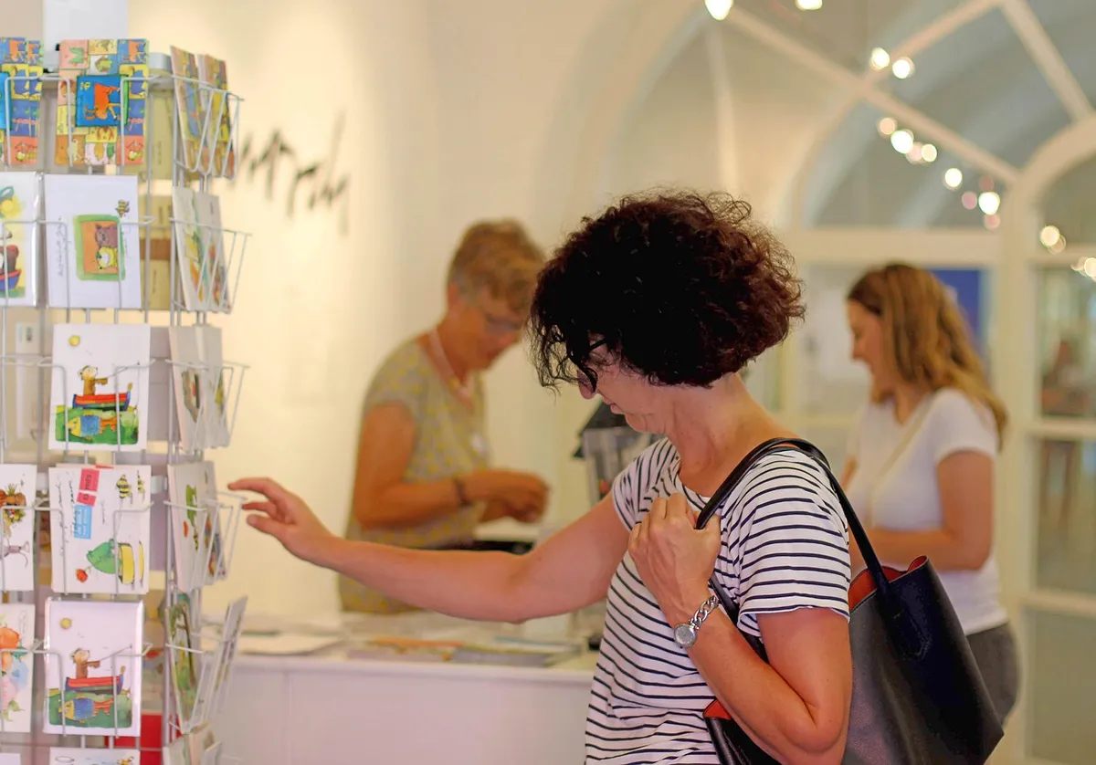 exhibition, visitors of the exhibition, postcards, post racks, cashbox, post ticket sales, sale, souvenir, vacations, letter mail, exhibition, exhibition, exhib
